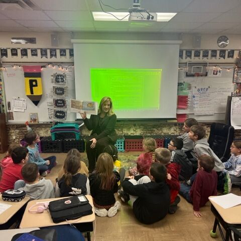 Anna Reading to Classroom of Kids